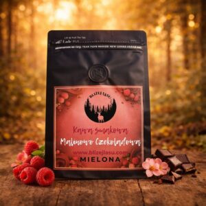 kawa mielona malinowa pralina 200 g w ciepłym leśnym świetle